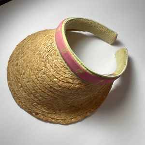 Scala straw visor with pink and green ribbon trim. Green palm trees on trim.